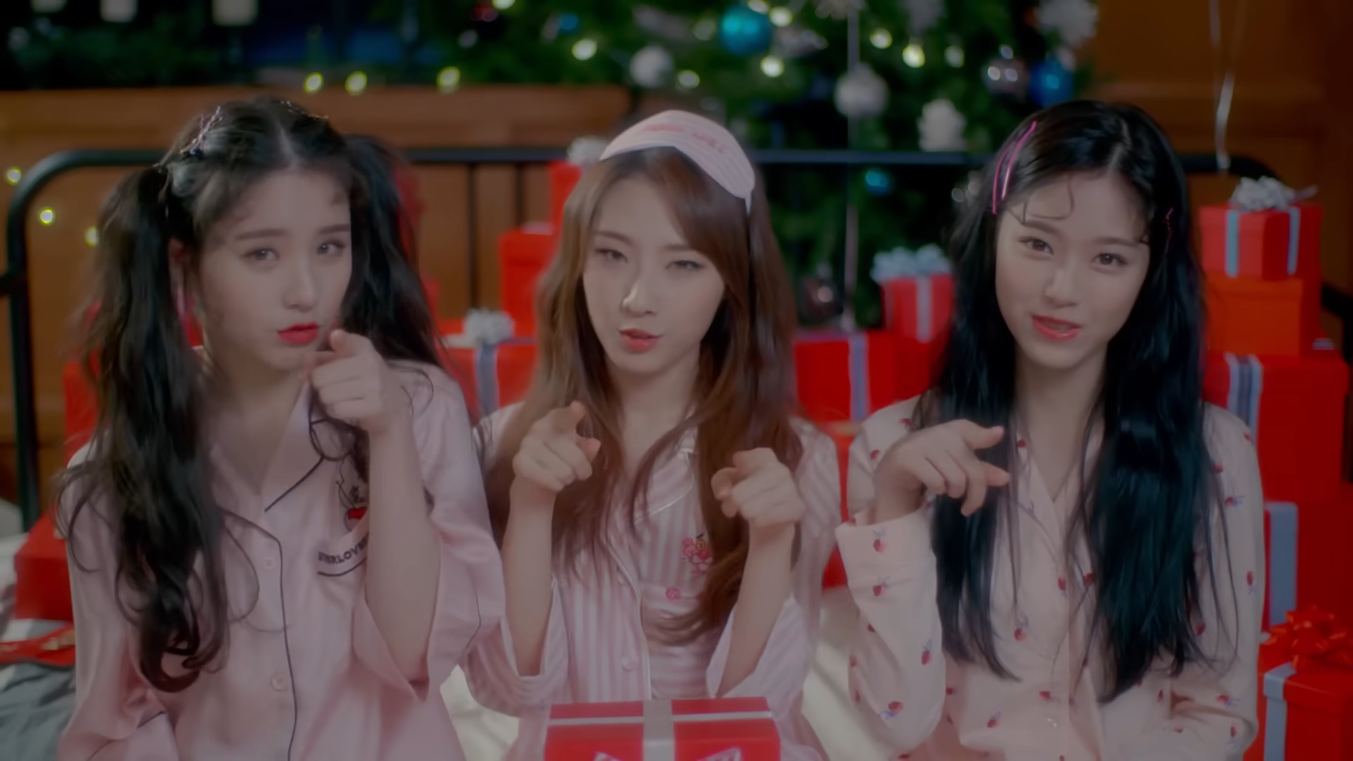 Heejin, Haseul, and Hyunjin wearing pajamas.